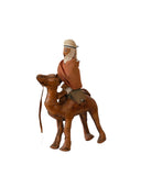 Isolated Toy Camel With Cameleer Made of Leather.